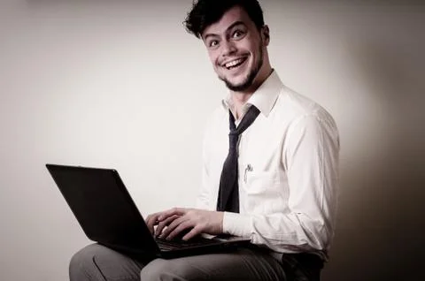Funny businessman using notebook Stock Photos