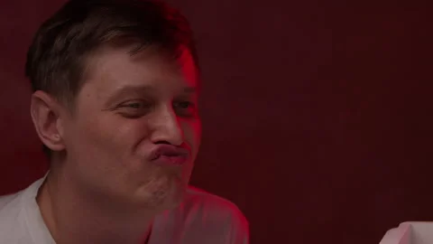 Funny Caucasian man making silly grimaces and puffing cheeks squinting eyes in Vídeo Stock 342807327