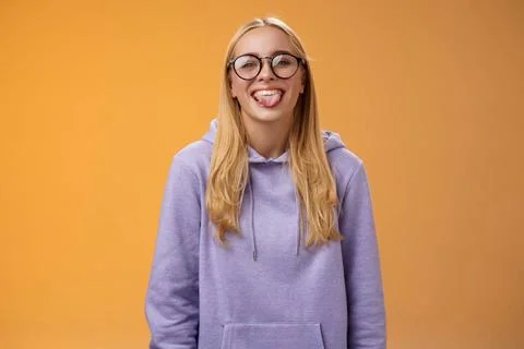Funny charming female programmer having fun show tongue fool around cowork... Stock Photos