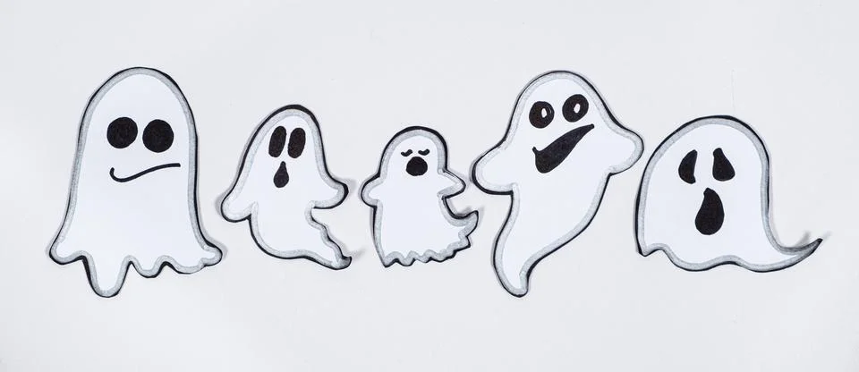 Funny charming ghosts with faces on a white background, top view 스톡 일러스트