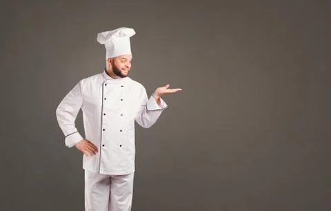 Funny chef with beard cook. Stock Photos