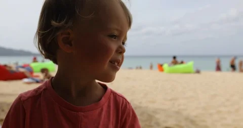 Funny child on beach Stock Footage 100023202