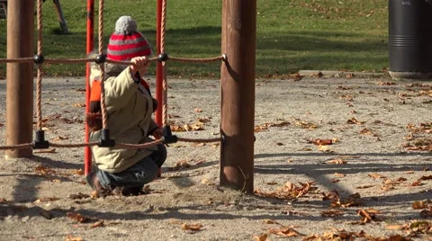 Funny child playing at playground, amusing boy overcome obstacle, smiling  Stock Footage 51956339