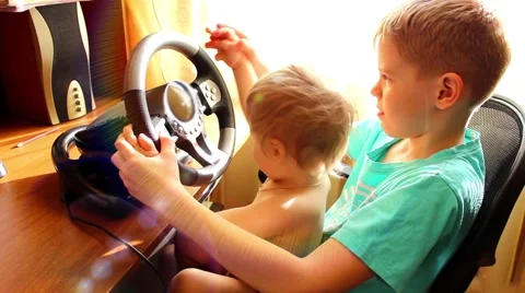 Funny children playing a computer game Видео 62429749