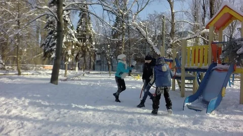 Funny children throw snow at each other. Slow motion, 스톡 동영상 87543688