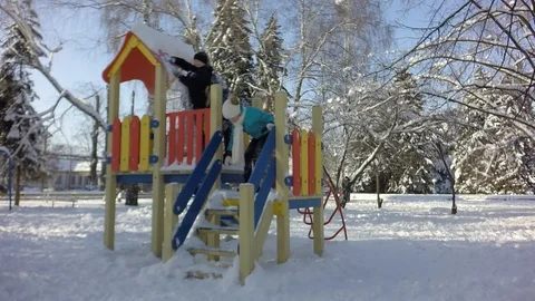 Funny children throw snow at each other. Slow motion, Stock-Footage 88243060