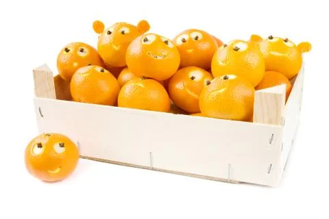 Funny clementines in box Stock Photos