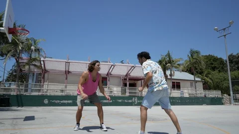 Funny clip as a guy is showing off and then gets his shot blocked hard. Stock Footage 93424201