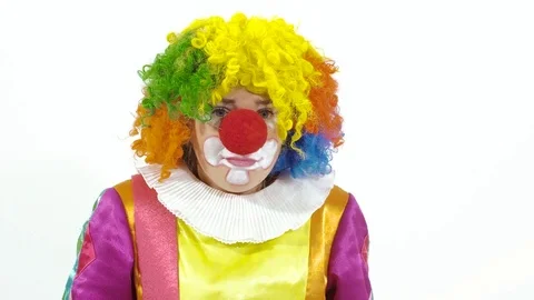 Funny clown pretends he doesn it hear and picks up big ear Stock-Footage 70283262