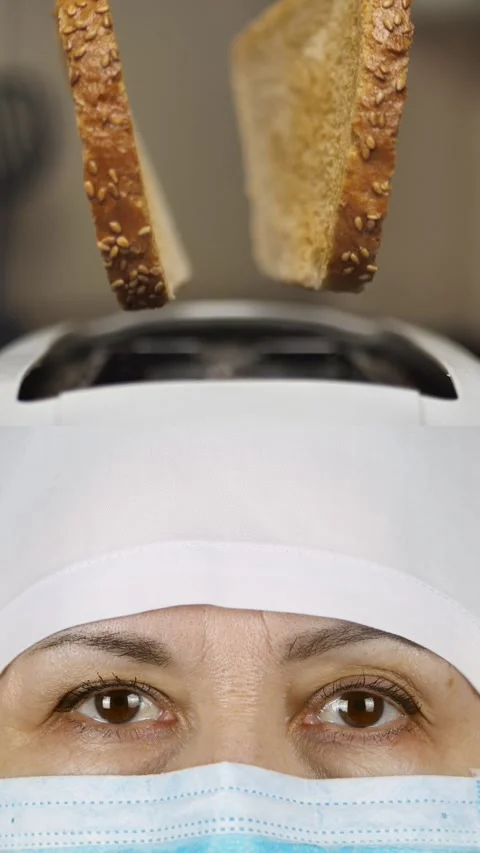 Funny collage. Close-up of female doctor in medical protective mask, toast from Stock Footage 290153553