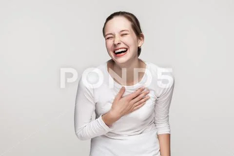 Funny concept. Expressing young adult freackles woman toothy smiling. Stock Photos