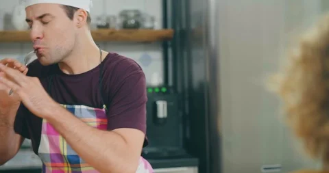 Funny couple having fun enjoying cooking 動画素材 114119216