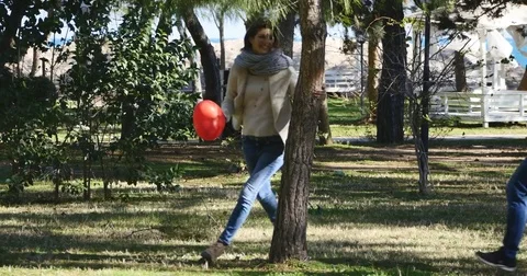 Funny couple running in a park Stock Footage 73310096