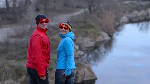 Funny couple turn around in amusing sunglasses and laugh Video stock 84814148