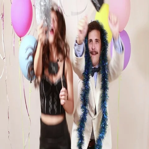 Funny crazy couple in love having fun in photo booth Stock Footage 69303418