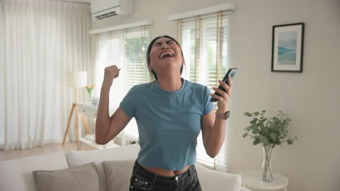 Funny crazy dance conquest from online game winning on cellphone. Stock Footage 311106873