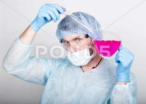 Funny crazy emotional chemist with flask. mad scientist in his laboratory Stock Photos