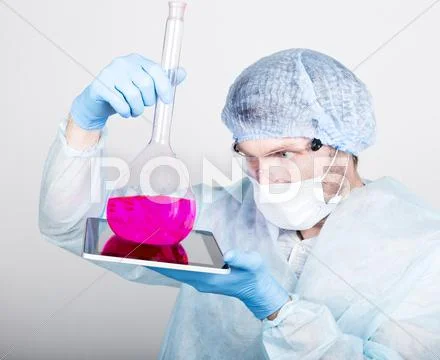 Funny crazy emotional chemist with flask. mad scientist in his laboratory Stock Photos