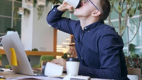 Funny Crazy Programmer with Caffeine Addiction Drinking Coffee and Typing Fast Stock Footage