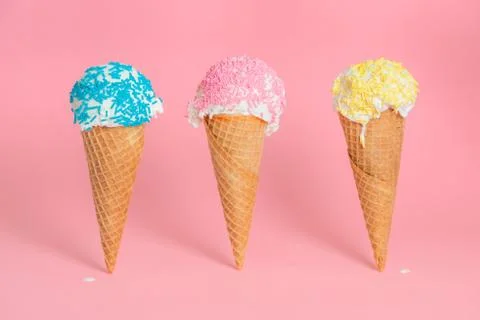 Funny creative concept of close up three wafer cups with melting ice cream an Foto stock