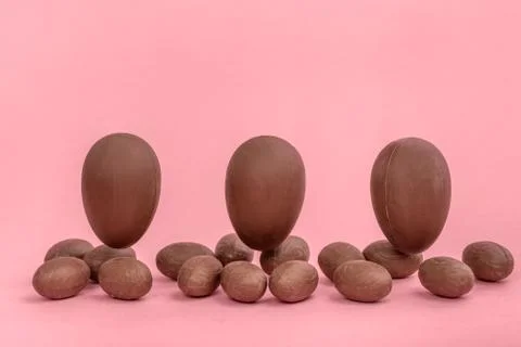 Funny creative concept of flying Easter eggs on pink background, copy space 스톡 사진