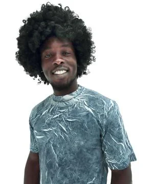 Funny curly haired guy looking at the camera. Stock Photos