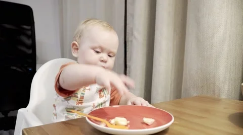 Funny cute baby eating banana Stock Video Pond5