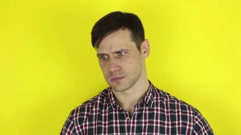 A funny, cute guy is actively playing with a purple balloon. Stock Footage 127645518