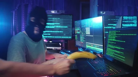 Funny Cyber Hackers Coding on Computer or Man in Mask Hacking Program on Laptop Stock Footage 234286661