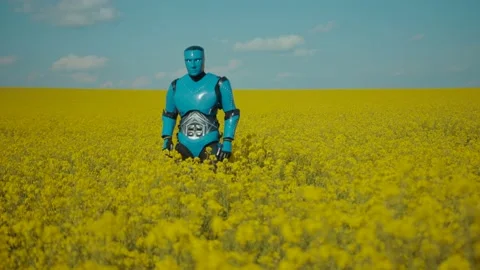 Funny cyborg humanoid performing a comical funky robot dance on flower field Stock Footage 133295473