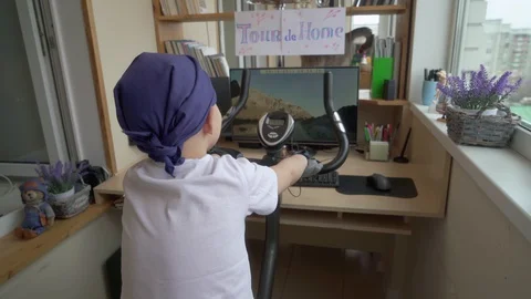 Funny Cyclist Boy Is Imagining Himself a Participant In Cycling Competition Video stock 129586606