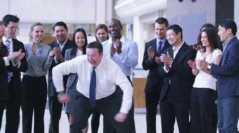 Funny dancing businessman.  Excited group of business people clap their strange Stock Footage