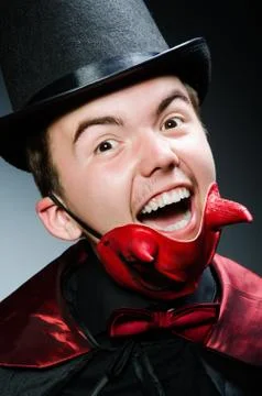 Funny devil against dark background Stock Photos