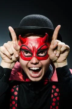 Funny devil against dark background Stock Photos