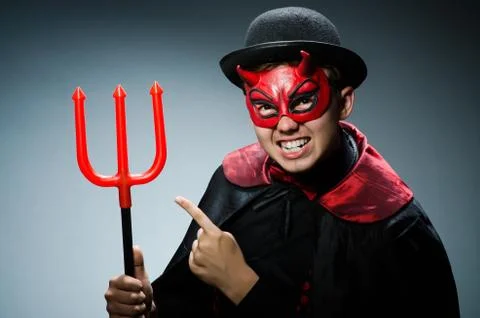 Funny devil against dark background 스톡 사진