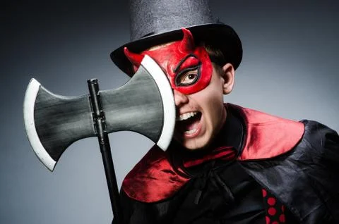 Funny devil against dark background Stock Photos