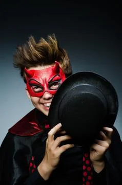 Funny devil against dark background Stock Photos