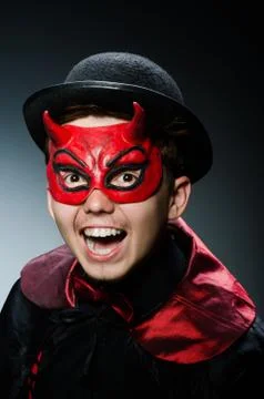 Funny devil against dark background Stock Photos