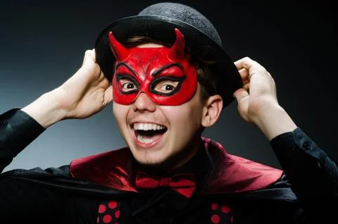 Funny devil against dark background Stock Photos