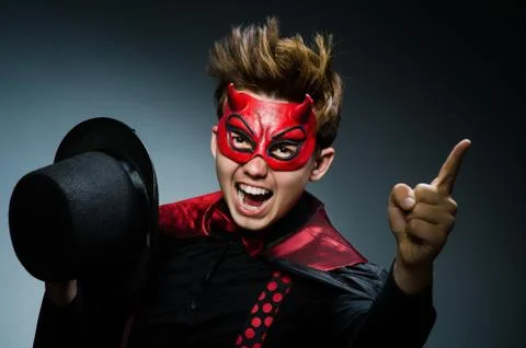 Funny devil against dark background Stock Photos