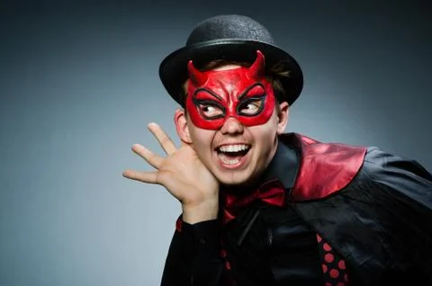 Funny devil against dark background Stock Photos