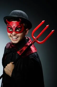 Funny devil against dark background Stock Photos