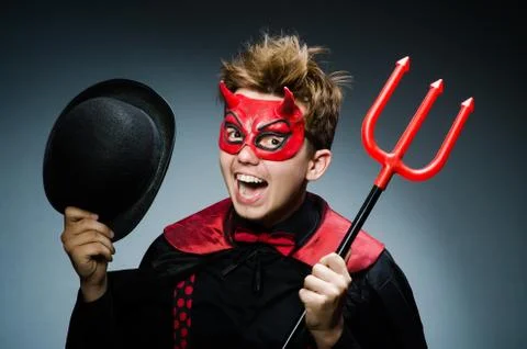 Funny devil against dark background Stock Photos