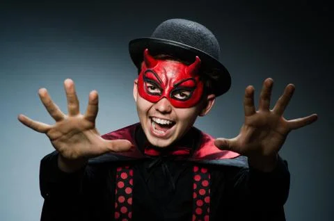 Funny devil against dark background Stock Photos