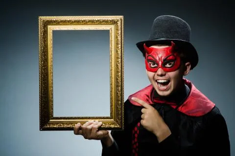 Funny devil with picture frame 写真素材