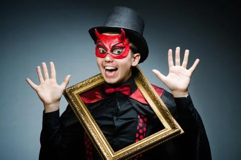 Funny devil with picture frame 写真素材