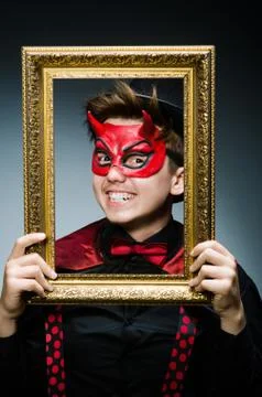 Funny devil with picture frame 写真素材
