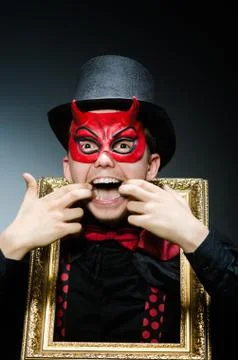Funny devil with picture frame 写真素材