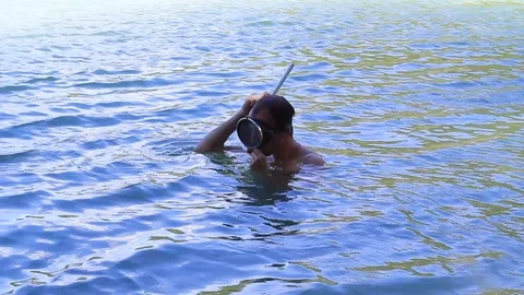 Funny diver learns to dive Stock Footage 94113980