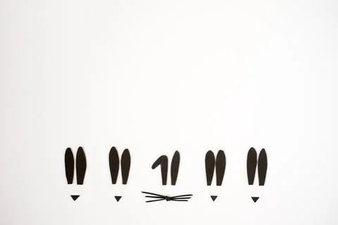Funny Easter background with sihouettes of bunny's ears, whiskers on white Stock Photos